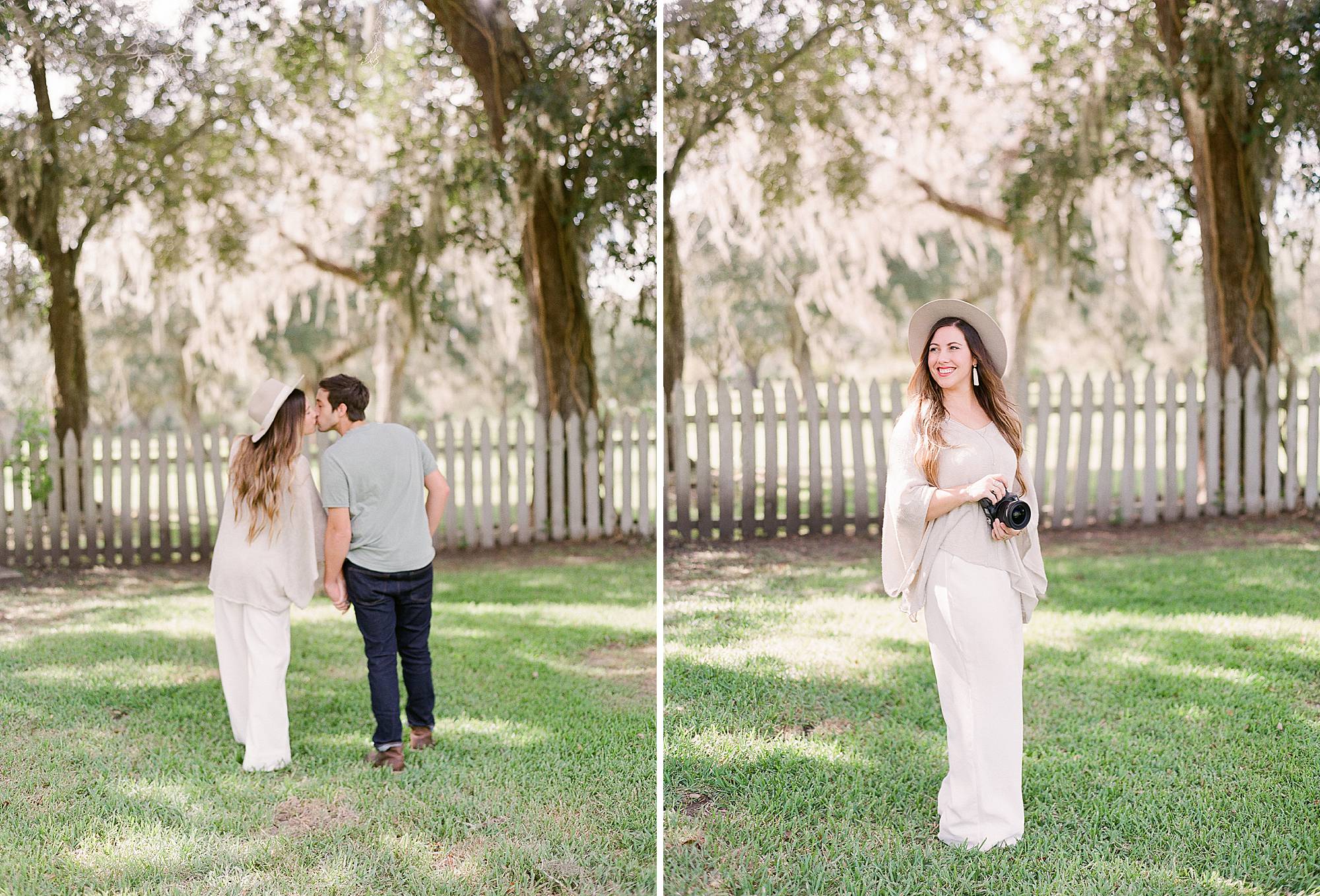 Photographer poses with camera for head shots in stylish outfit 