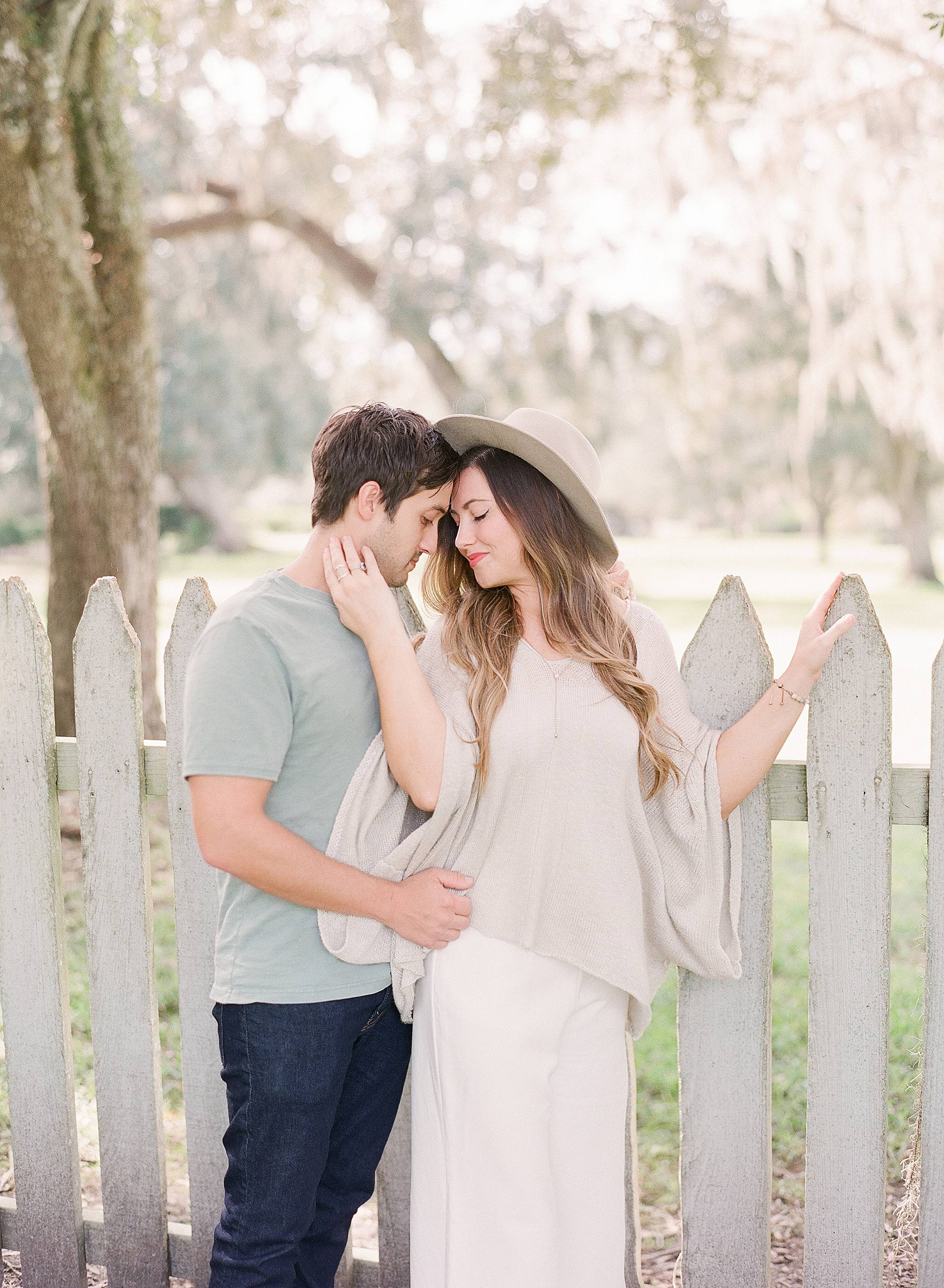 Engagement photographs taken in Jungle Gardens New Iberia in fashionable outfit