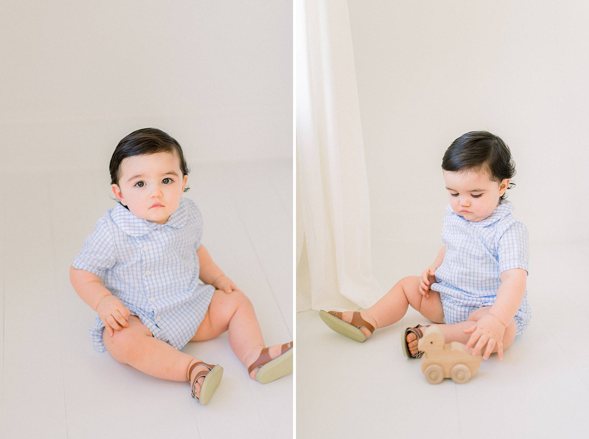 baby playing with antique toy photographed for one year portraits