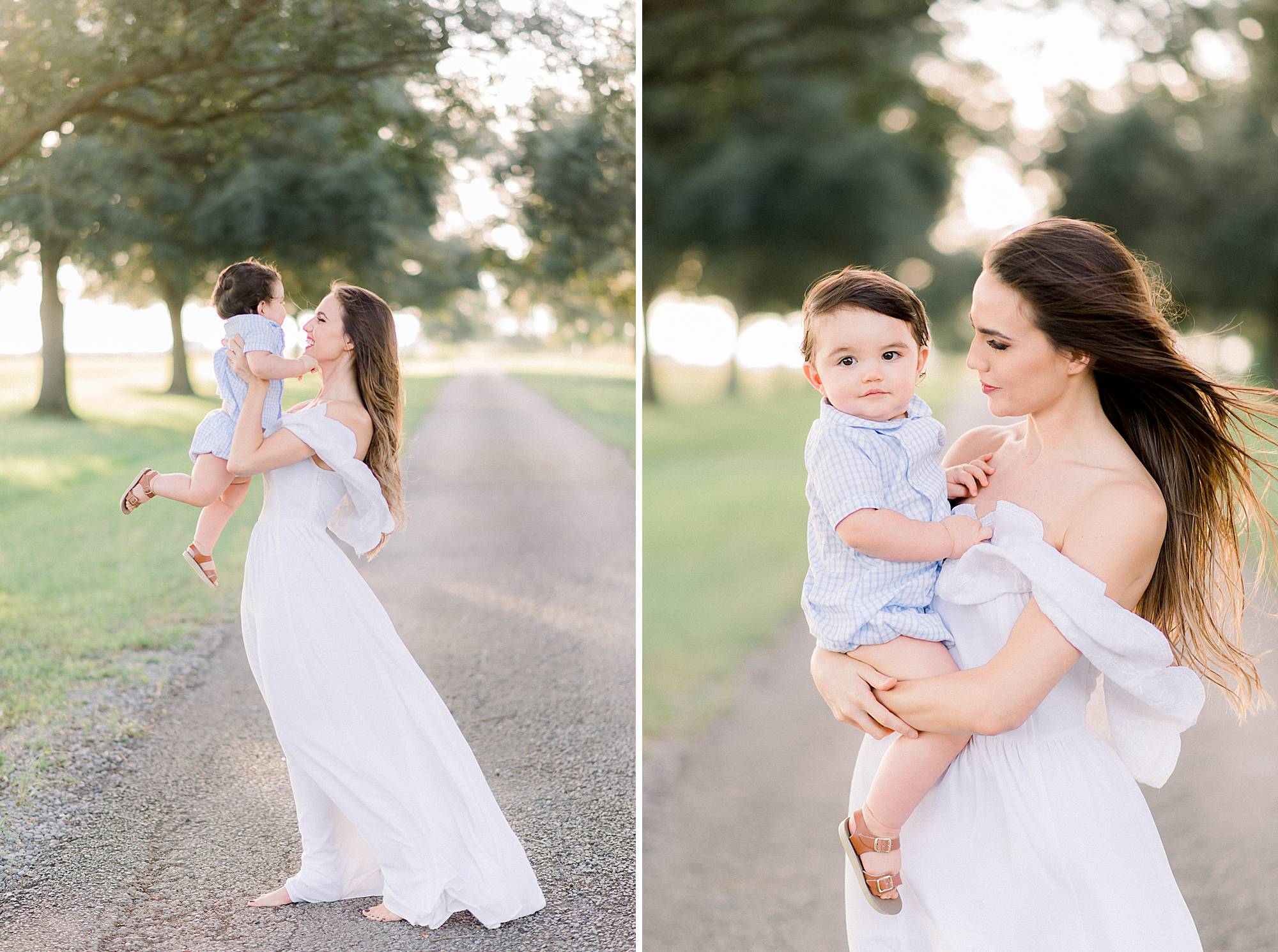 baby being lifted in the air as moms dress blows in the wint