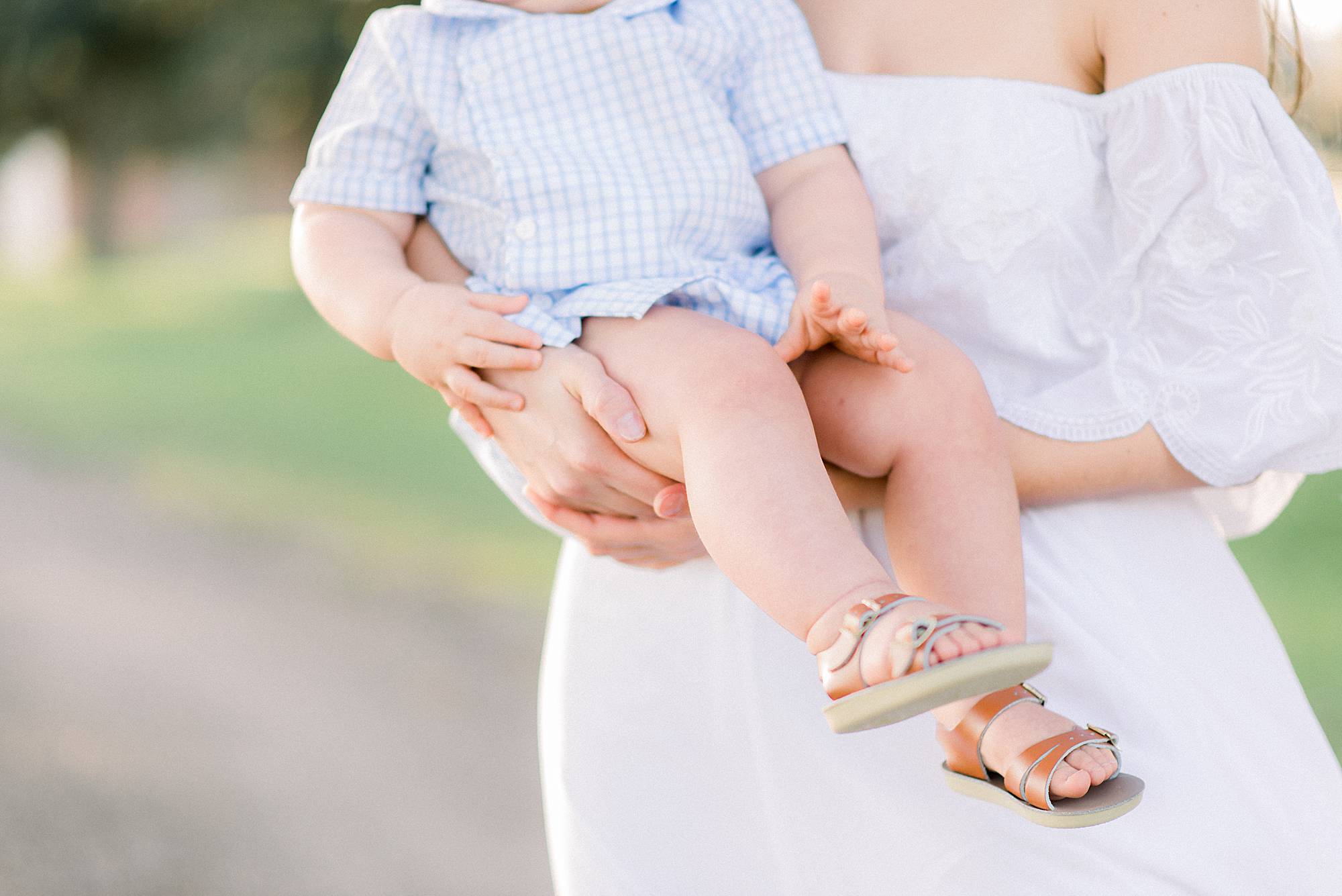 mother holding her son his hand on hers