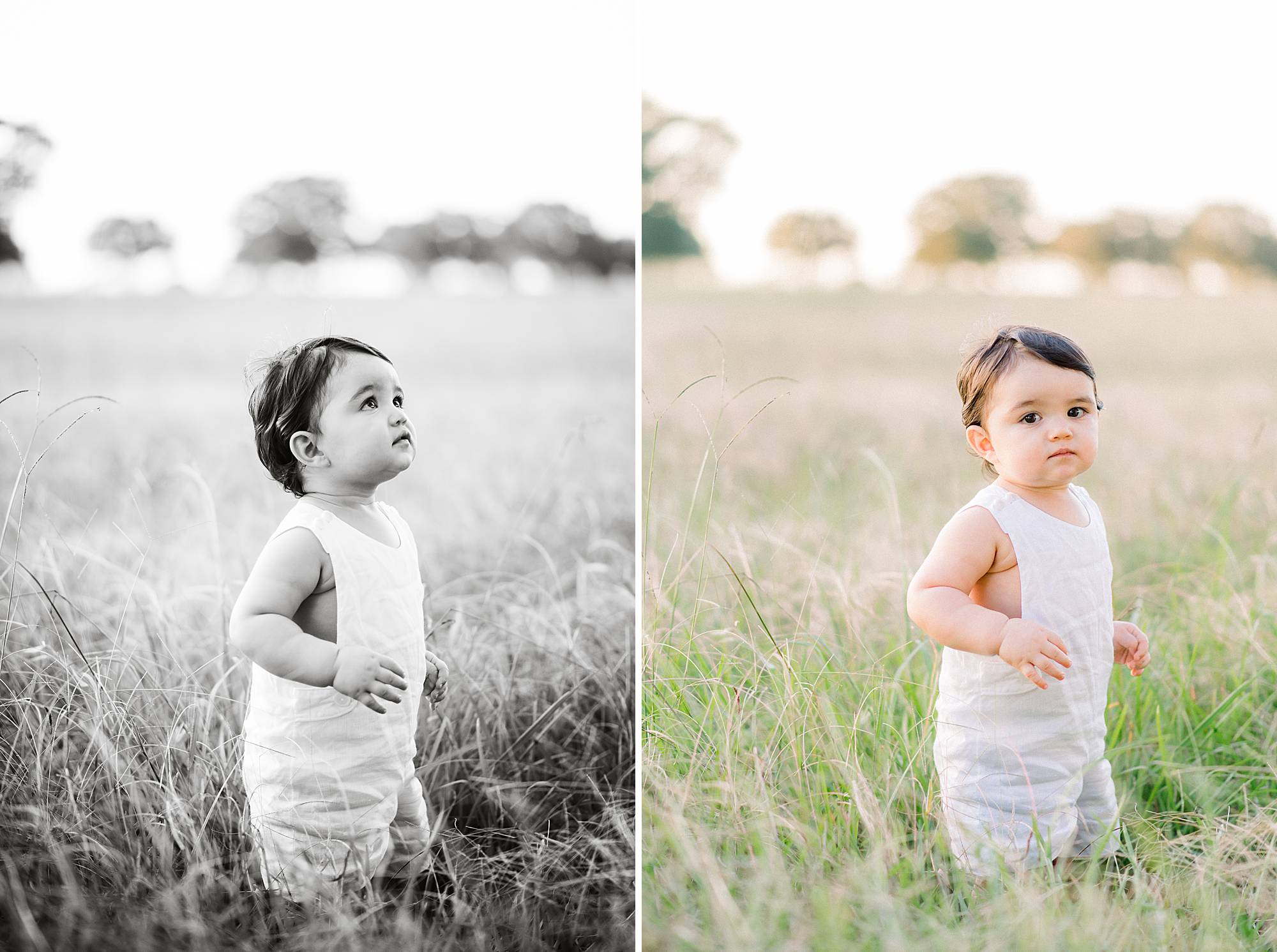 baby looking into the sky in a field
