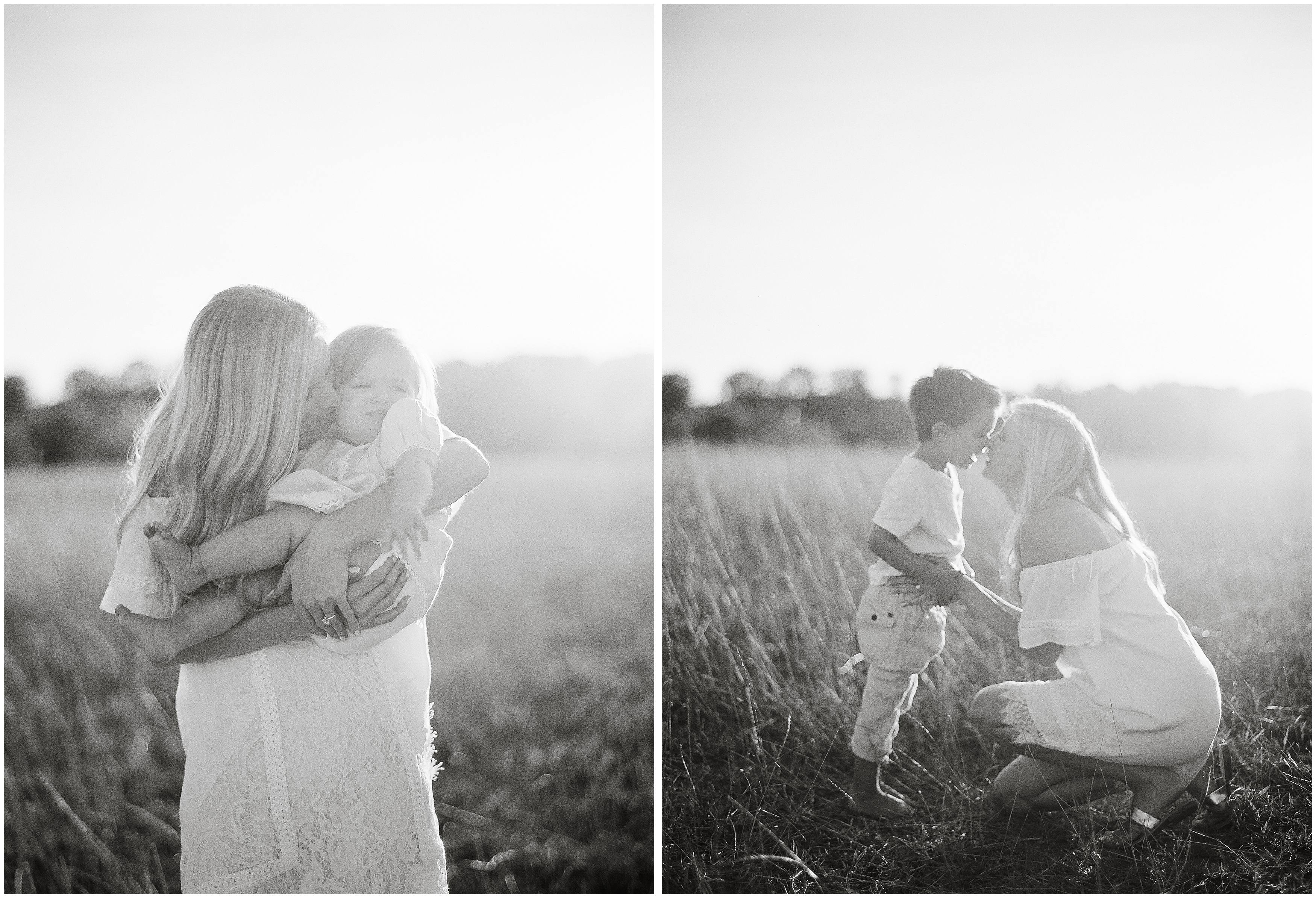 film photography black and white image of mom holding children in a field in louisiana