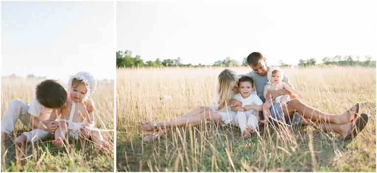 family of four snuggles in a field photographed candidly by Louisiana photographer