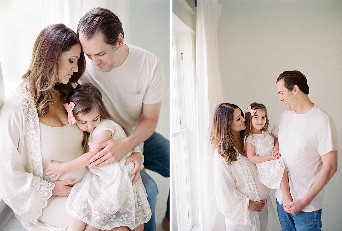 little sister hugs moms belly as she poses for maternity photo session 