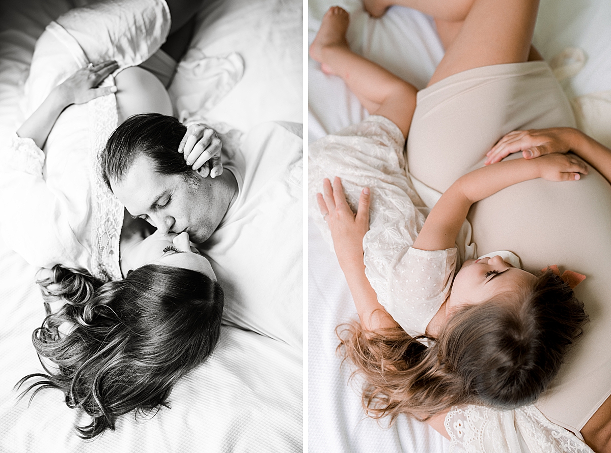 intimate moment as little sister snuggles with moms pregnant belly  