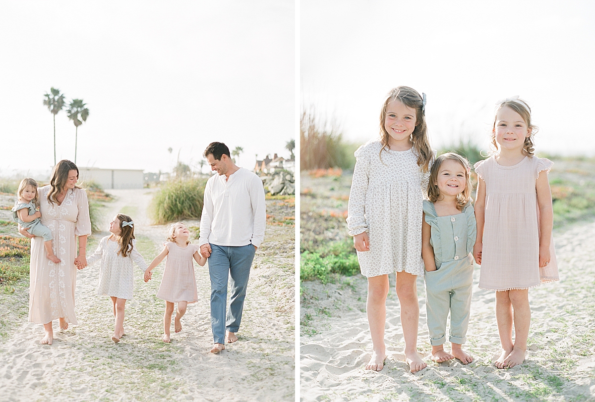 family at Corona Beach California walking in the sand holding hand together
