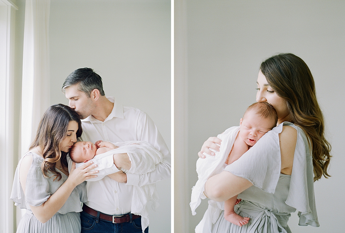 Mother holding newborn baby on her shoulder rocking them to sleep