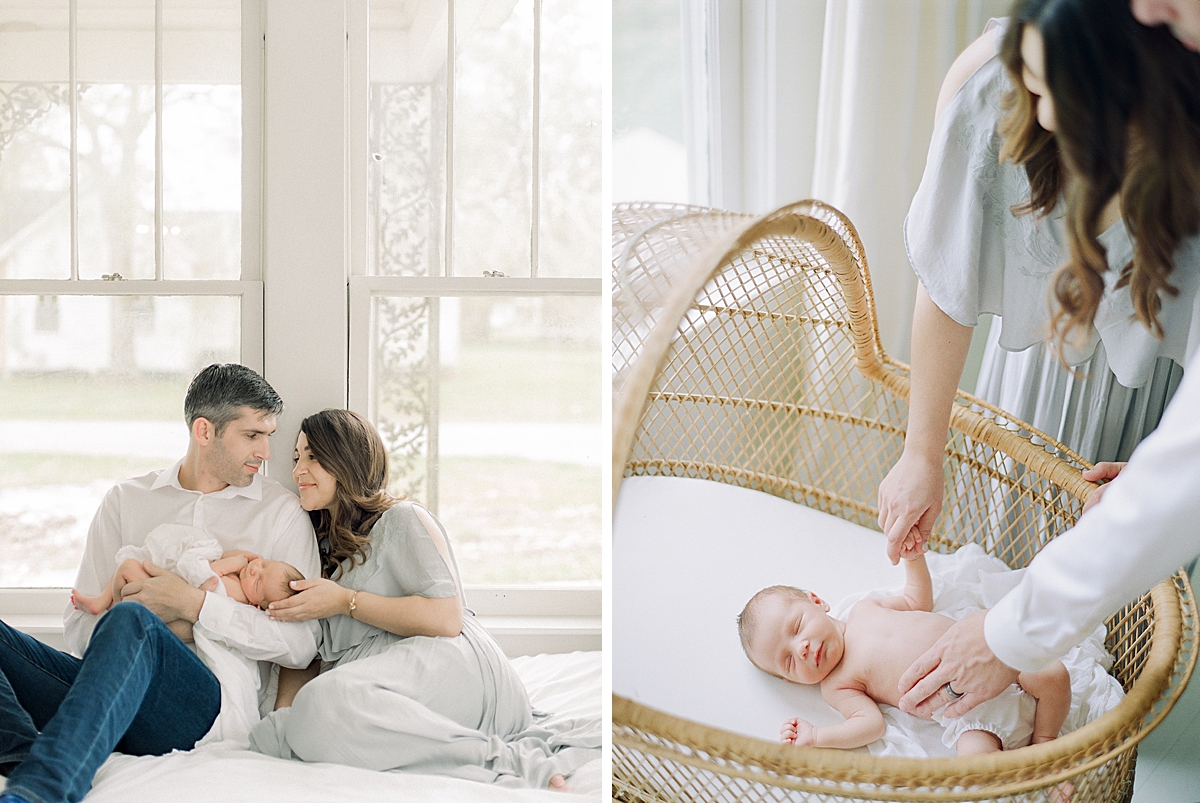 Mother and Father cuddle in bed holding their brand new baby boy