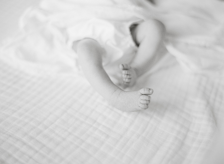 black and white photograph of baby toes