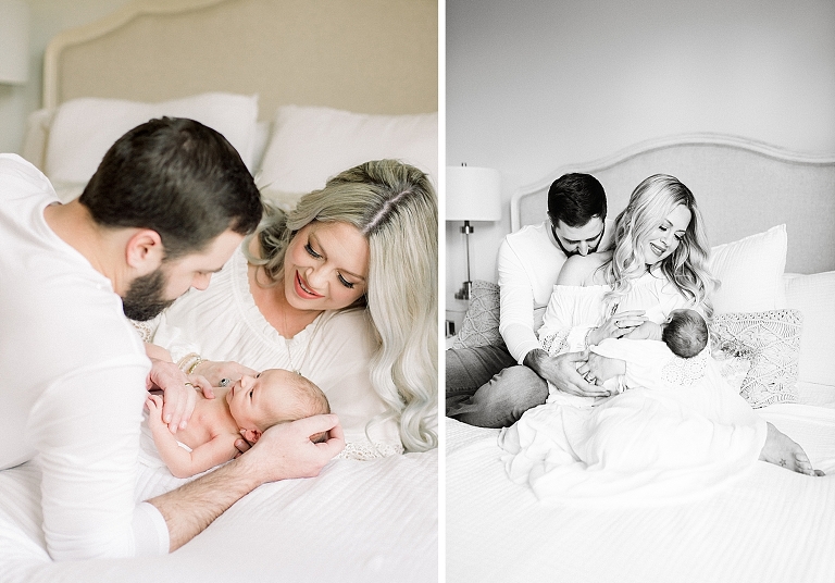 new parents may on bed in master bedroom with newborn baby boy smiling at him