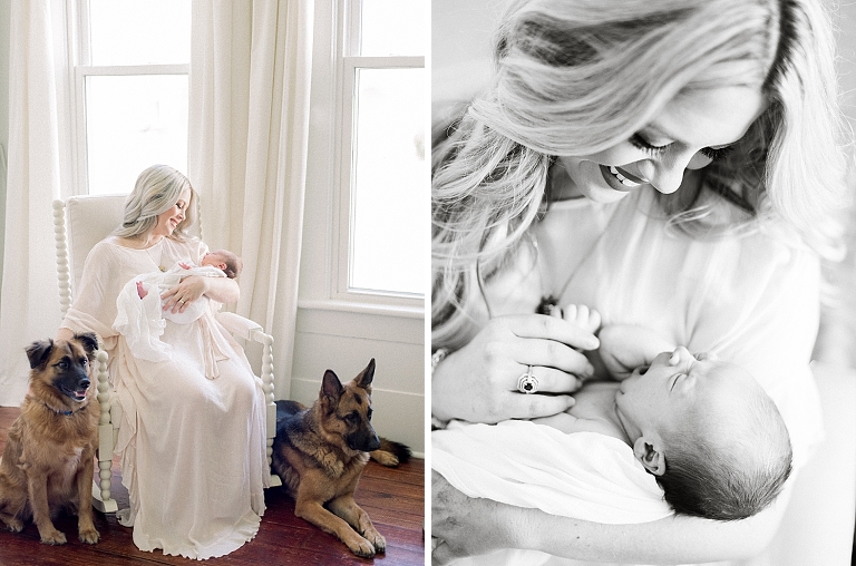 mother in newborn nursery rocking her infant and watching her dogs play inside while getting photographed for her lifestyle session
