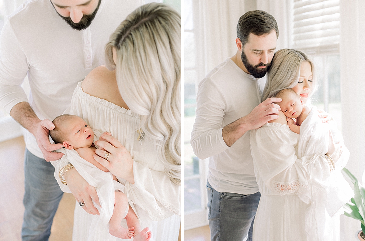 Parents hold newborn baby boy as they rub his head to sleep, they waited many years to have a child of their own