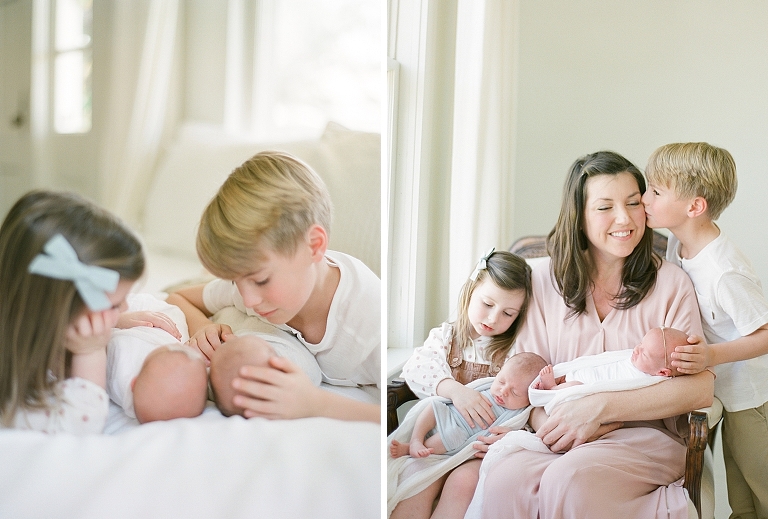 big brother gives his mom a kiss as she holds her new twin newborns cradled in her arms 