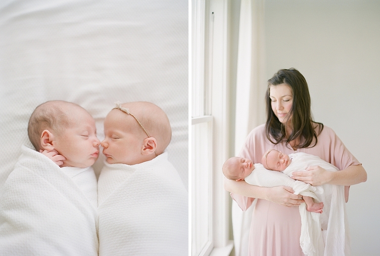 mother holds both of her newborn twins together
