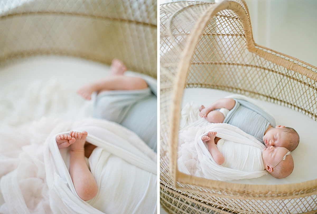 newborns twins laying in crib with detail of their feet peaking out of the swaddled blanket