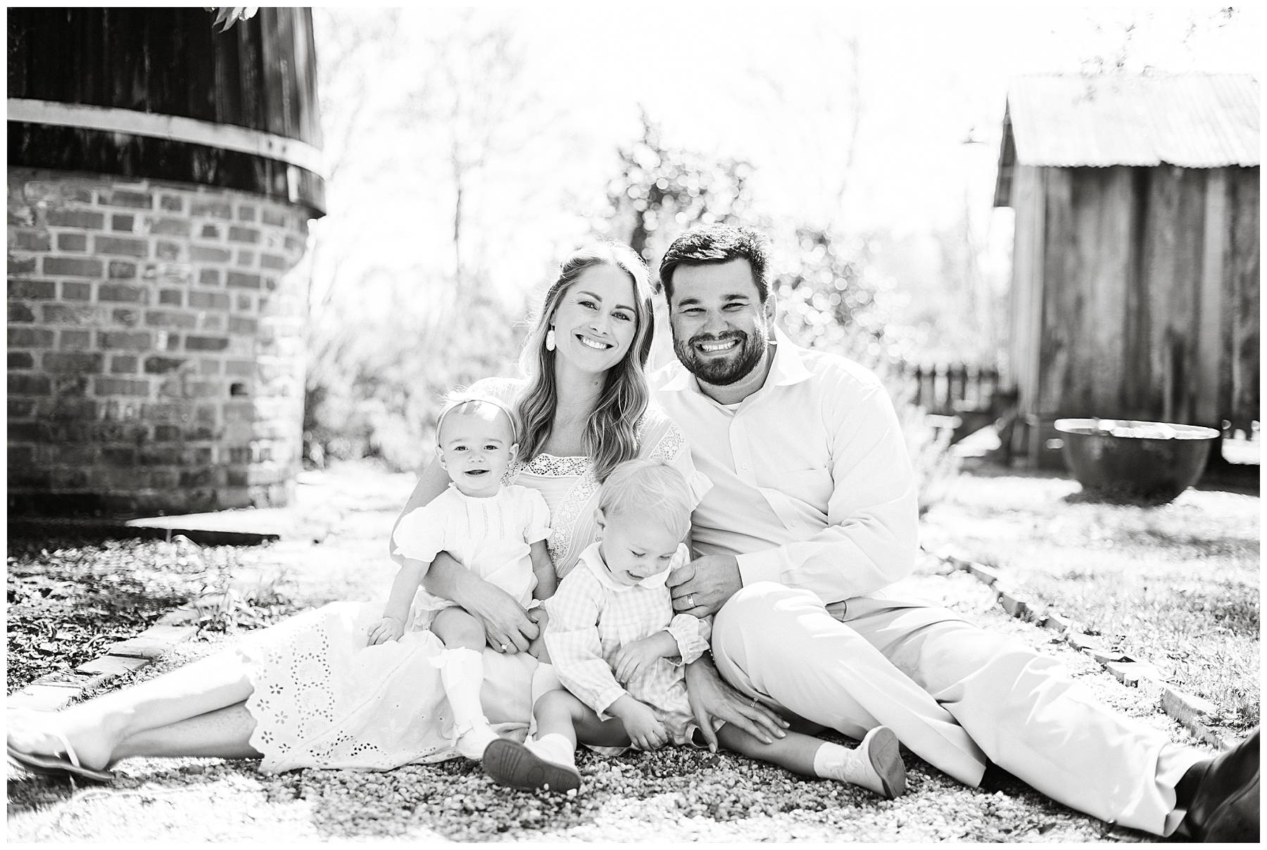 Classic black and white family portrait traditional smiling at the camera.