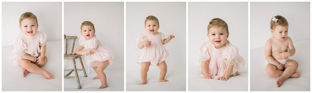 Portraits of a baby at twelve months for her birthday in white photography studio dressed in heirloom outfit